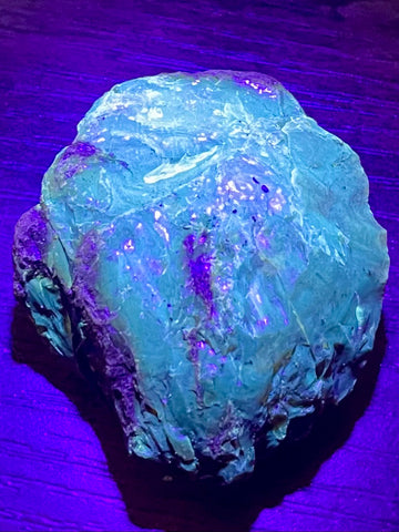 Fluorescent Blue Amber Palm Stone