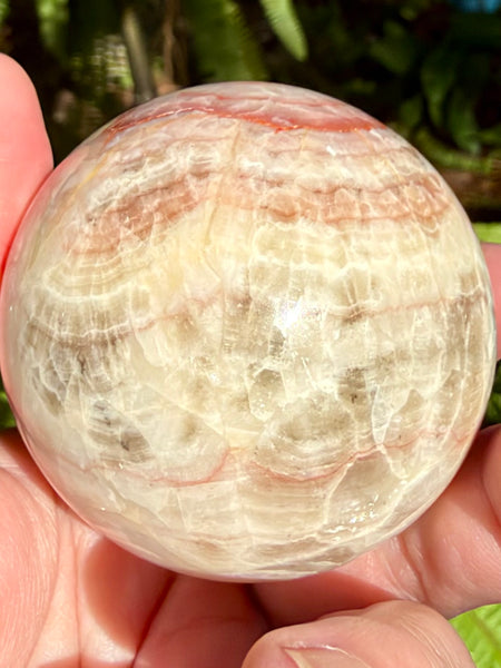 Beautiful Red Calcite Sphere - Morganna’s Treasures